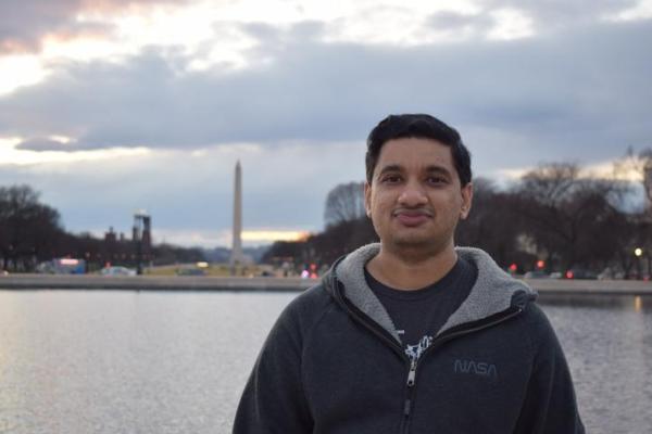 International student smiling in front of Washington monument